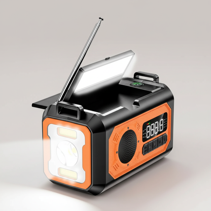 Radio awaryjne pomarańczowe z włączoną lampką i latarką